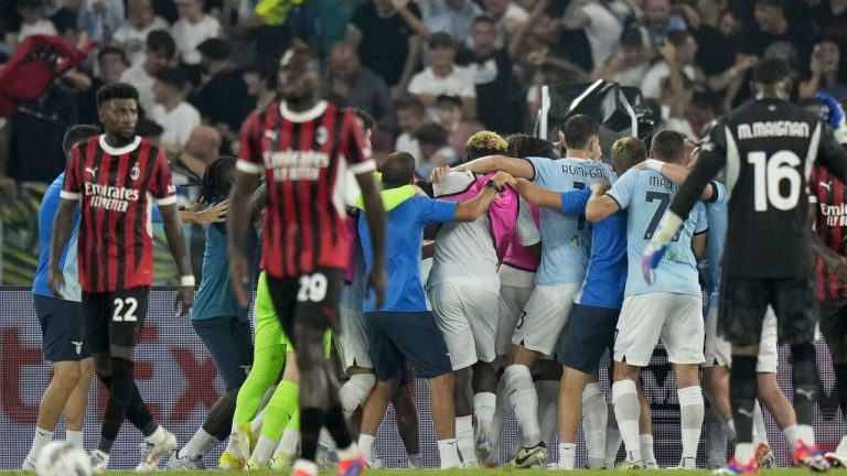 Lazio players, in the background, celebrate after Lazio's Boulaye Dia scored their second goal during a Serie A soccer match between Lazio and AC Milan, at Rome's Stadio Olimpico, Saturday, Aug. 31, 2024. (Andrew Medichini/AP Photo)
