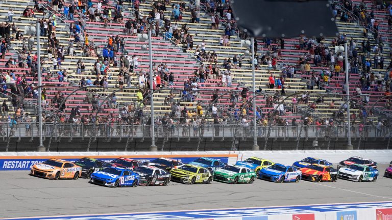 Racing fans watch a NASCAR Cup Series auto race at Michigan International Speedway, Monday, Aug. 19, 2024, in Brooklyn, Mich. (Carlos Osorio/AP)