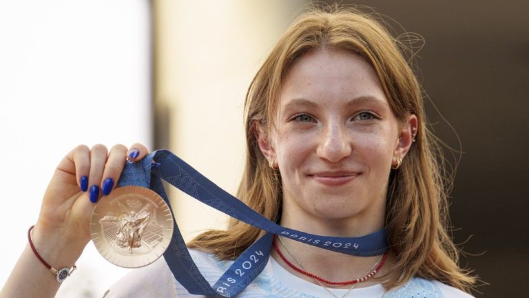 Romanian gymnast Ana Barbosu poses with the bronze medal for her women's artistic gymnastics individual floor performance at the Paris 2024 Olympics, after receiving it during a ceremony at the Romanian Olympic and Sports Committee, in Bucharest, Romania, Friday, Aug. 16, 2024. (AP Photo/Vadim Ghirda)
