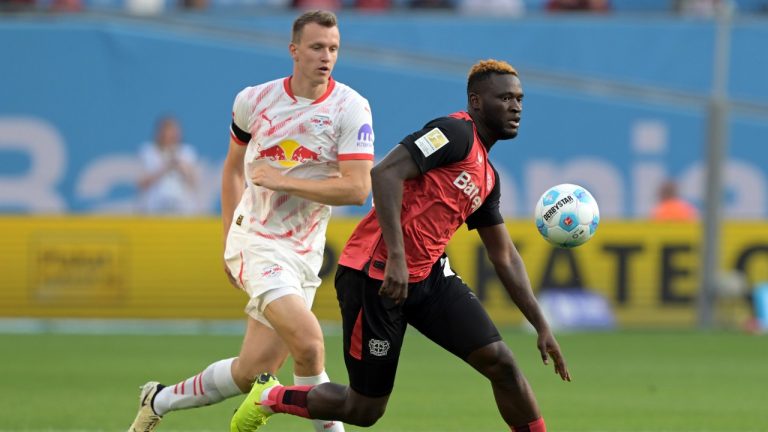 Leverkusen's Victor Boniface, right, and Leipzig's Lukas Klostermann battle for the ball during the Bundesliga soccer match between Bayer Leverkusen and RB Leipzig at the BayArena, Leverkusen, Germany, Saturday Aug. 31, 2024.
(Federico Gambarini/dpa via AP)