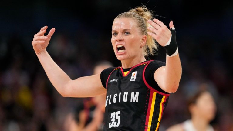 Julie Vanloo (35), of Belgium, shoots over Yuki Miyazawa (52), of Japan, in a women's basketball game at the 2024 Summer Olympics, Sunday, Aug. 4, 2024, in Villeneuve-d'Ascq, France. (AP Photo/Mark J. Terrill)