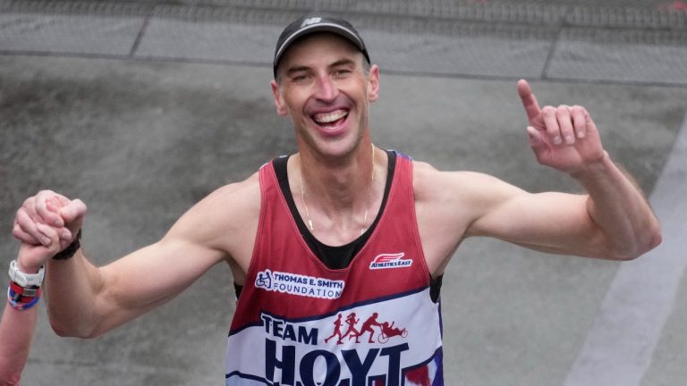 Boston Bruins NHL hockey great Zdeno Chara crosses the finish line of the Boston Marathon, Monday, April 17, 2023, in Boston. (AP)