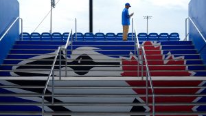 An usher waits for fans to arrive at TD Ballpark before a spring training baseball game between the Toronto Blue Jays and the Philadelphia Phillies Monday, March 4, 2024, in Dunedin, Fla. (Charlie Neibergall/AP Photo)