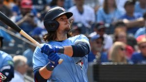 Toronto Blue Jays right fielder Addison Barger hits a two-run home run against the Los Angeles Angels, scoring Will Wagner during sixth inning MLB baseball action in Toronto on Sunday, Aug 25, 2024. (Jon Blacker/CP)