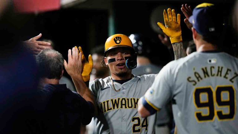 Milwaukee Brewers designated hitter William Contreras celebrates after hitting a two-run home during the ninth inning of the second game of a baseball doubleheader against the Cincinnati Reds, Friday, Aug. 30, 2024, in Cincinnati. (Carolyn Kaster/AP)