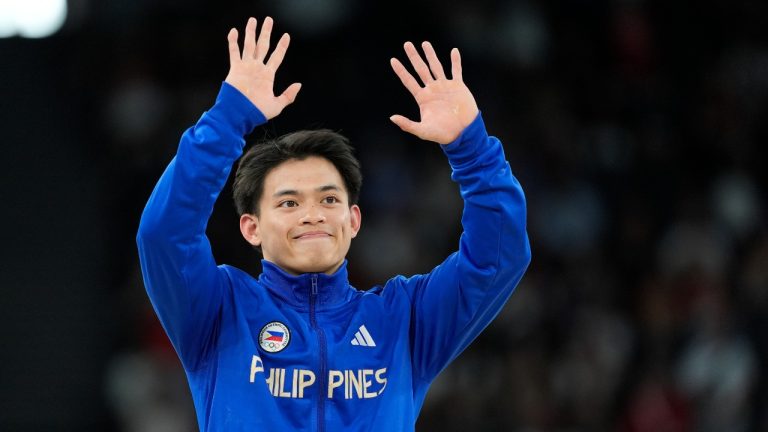 Carlos Edriel Yulo, of the Philippines, celebrates after winning the gold medal during the men's artistic gymnastics individual vault finals at Bercy Arena at the 2024 Summer Olympics, Sunday, Aug. 4, 2024, in Paris, France. (AP)