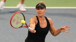 Gabriela Dabrowski of Canada hits a return as she, and doubles partner Erin Routliffe from New Zealand play against Magda Linette of Poland and Peyton Stearns of the United States at the National Bank Open in Toronto on Friday, August 9, 2024. (Chris Young/CP Photo)