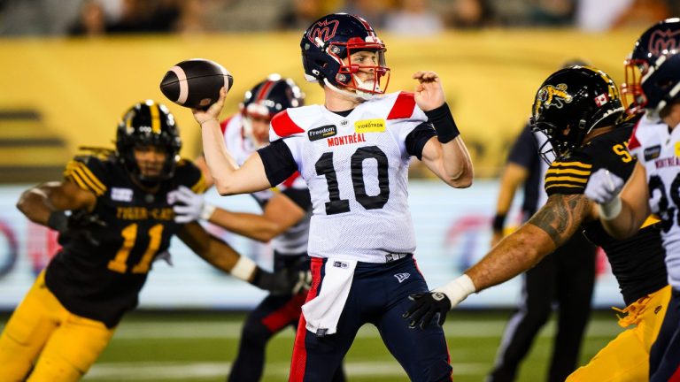 Montreal Alouettes quarterback Davis Alexander (10) throws a pass under pressure during second half CFL action against the Montreal Alouettes, in Hamilton, Ont., on Friday, August 2, 2024. THE CANADIAN PRESS/Christopher Katsarov