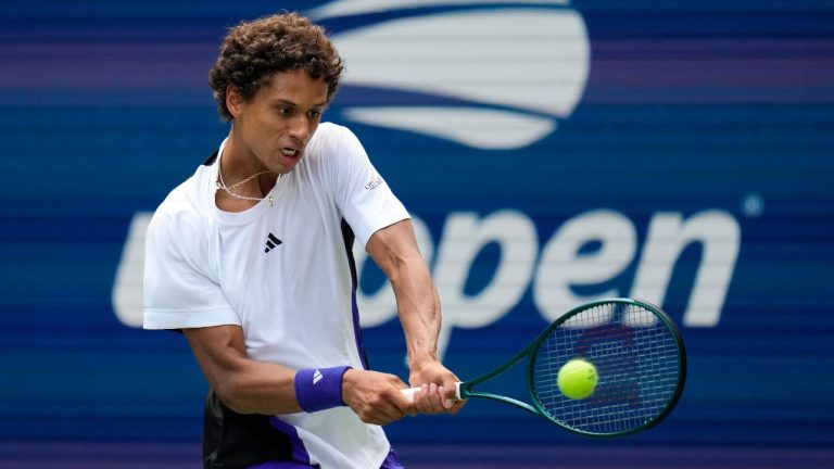 Gabriel Diallo, of Canada, returns a shot to Tommy Paul, of the United States, during the third round of the U.S. Open tennis championships, Saturday, Aug. 31, 2024, in New York. (Kirsty Wigglesworth/AP Photo)