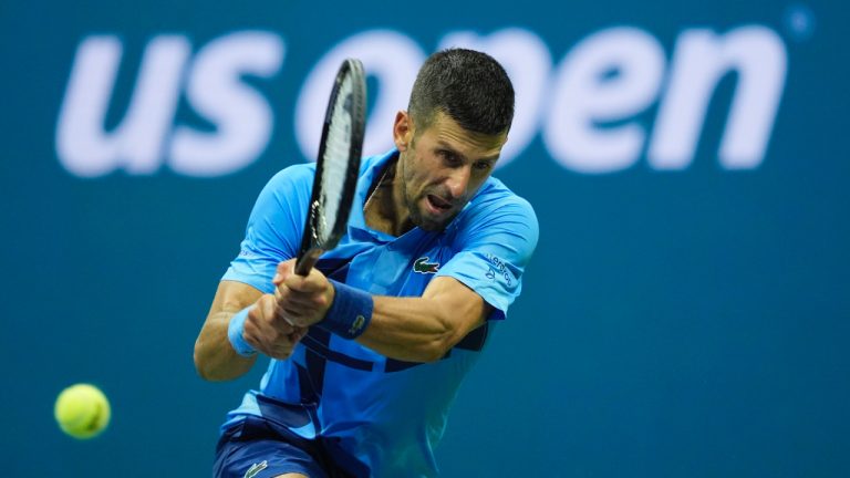 Novak Djokovic, of Serbia, returns a shot to Radu Albot, of Moldova, during a first round match of the U.S. Open tennis championships, Monday, Aug. 26, 2024, in New York. (Matt Rourke/AP)