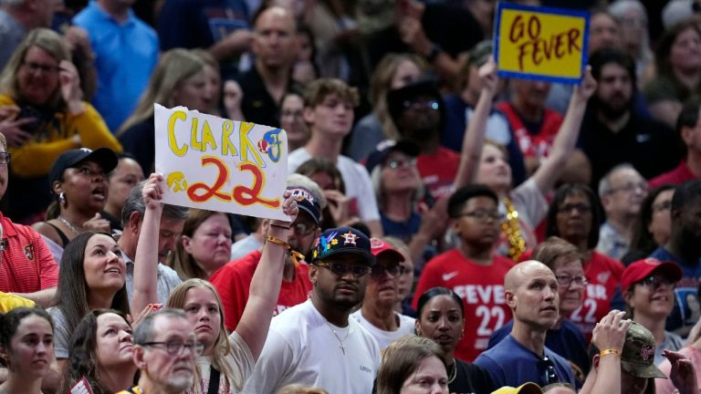 A fan holds up an Indiana Fever's Caitlin Clark sign during the second half of a WNBA basketball game against the New York Liberty, Saturday, July 6, 2024, in Indianapolis. (Darron Cummings/AP Photo)