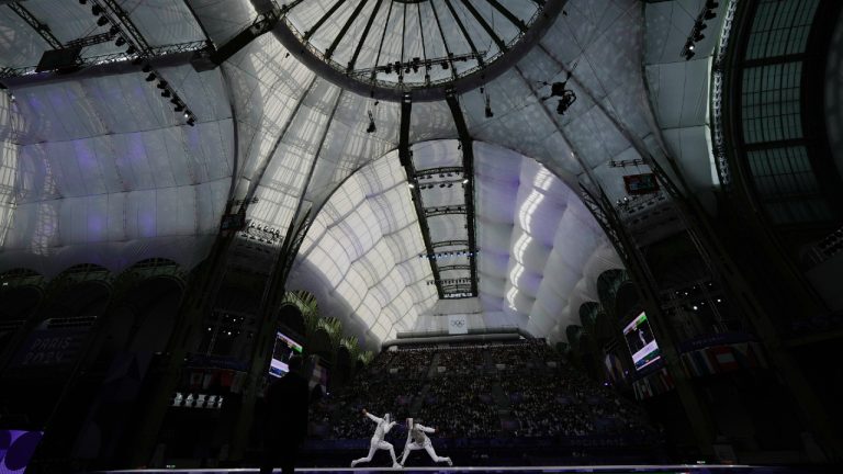 Fencers compete during the 2024 Summer Olympics at the Grand Palais, Sunday, Aug. 4, 2024, in Paris, France. (Andrew Medichini/AP)