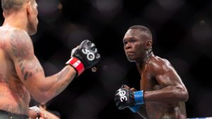 Israel Adesanya, right, and Alex Pereira fight in their middleweight title match during the UFC 287 event at the Kaseya Center on Saturday, April 8, 2023, in downtown Miami. (Matias J. Ocner/Miami Herald via AP)