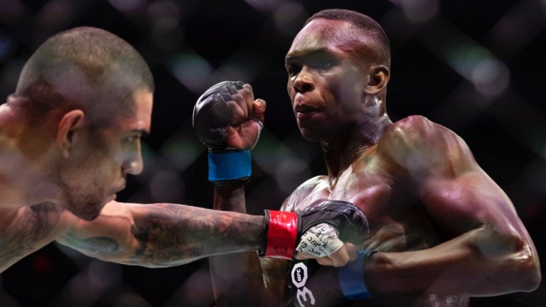 Israel Adesanya, right, and Alex Pereira fight in their middleweight title match during at UFC 287. (Matias J. Ocner/Miami Herald via AP)