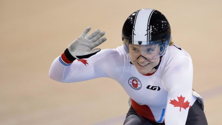 Canada's Kate O'Brien celebrates after the women's sprint quarterfinals track cycling competition at the Pan Am Games in Milton, Ontario, Saturday, July 18, 2015. (Felipe Dana/AP)