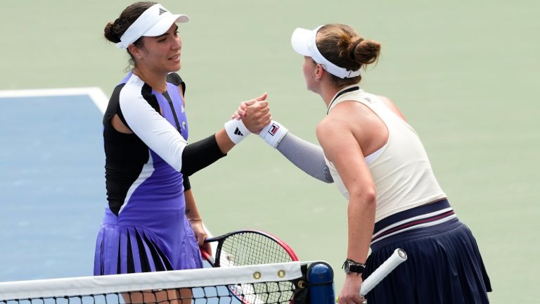 Elena-Gabriela Ruse, of Romania, left, shakes hands with Barbora Krejcikova, of the Czech Republic, after winning their second round match of the U.S. Open tennis championships, Wednesday, Aug. 28, 2024, in New York. (Kirsty Wigglesworth/AP)