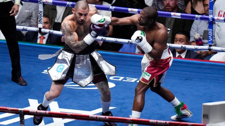 Floyd Mayweather, right, and John Gotti III fight during an exhibition boxing match at the Arena Mexico in Mexico City, Saturday, Aug. 24, 2024. (Eduardo Verdugo/AP)