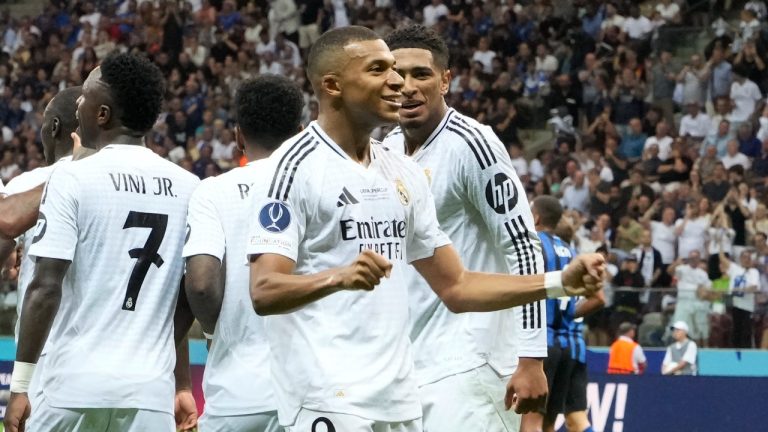 Real Madrid's Kylian Mbappe, second from right, celebrates after scoring his side's second goal during the UEFA Super Cup Final soccer match between Real Madrid and Atalanta at the Narodowy stadium in Warsaw, Poland, Wednesday, Aug. 14, 2024. (AP/Czarek Sokolowski)