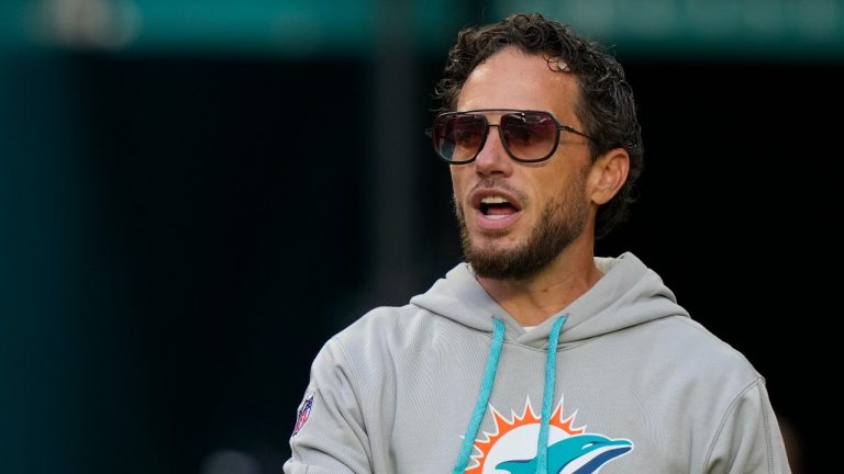 Miami Dolphins head coach Mike McDaniel heads onto the field before the start of a preseason NFL football game against the Washington Commanders, Saturday, Aug. 17, 2024, in Miami Gardens, Fla. (AP Photo/Wilfredo Lee)