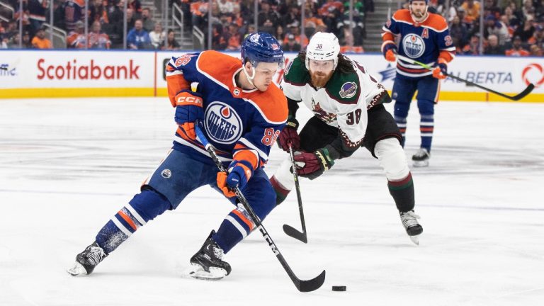 Arizona Coyotes' Liam O'Brien (38) chases Edmonton Oilers' Philip Broberg (86) during third period NHL action in Edmonton on Wednesday March 22, 2023. (Jason Franson/CP)