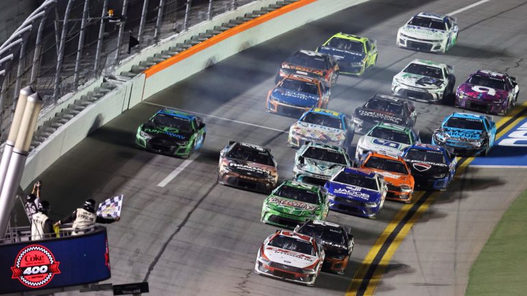 Harrison Burton (21) takes the checkered flag to win a NASCAR Cup Series auto race at Daytona International Speedway, Saturday, Aug. 24, 2024, in Daytona Beach, Fla. (David Graham/AP)