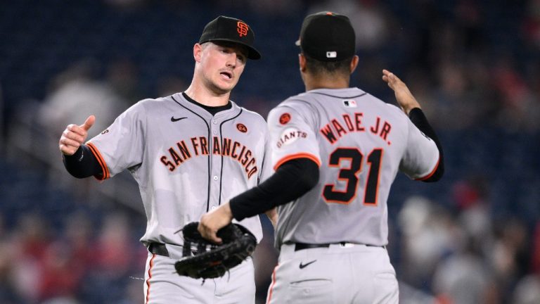 San Francisco Giants' Matt Chapman, left, and LaMonte Wade Jr. (31) celebrate after a baseball game against the Washington Nationals, Monday, Aug. 5, 2024, in Washington. The Giants won 4-1. (Nick Wass/AP)