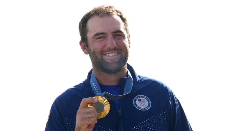 Gold medalist Scottie Scheffler, of the United States, poses with his medal following the medal ceremony for men's golf during the medal ceremony at the 2024 Summer Olympics, Sunday, Aug. 4, 2024, at Le Golf National in Saint-Quentin-en-Yvelines, France. Scottie Scheffler, of the United States, won the gold medal with Tommy Fleetwood, of Britain, silver and Hideki Matsuyama, of Japan, the bronze.(Matt York/AP)