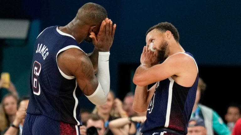 United States' Stephen Curry (4) and LeBron James (6) celebrate after beating France to win the gold medal during a men's gold medal basketball game at Bercy Arena at the 2024 Summer Olympics, Saturday, Aug. 10, 2024, in Paris, France. (Mark J. Terrill/AP Photo)