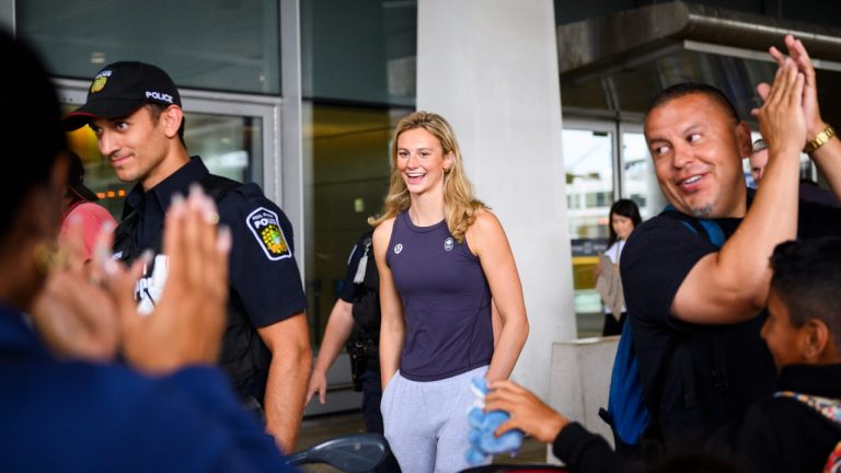 Olympic medalist Summer McIntosh is cheered by fans after arriving at Pearson airport following the 2024 Paris Olympic Games, in Toronto, Monday, Aug. 12, 2024. (Christopher Katsarov/CP)