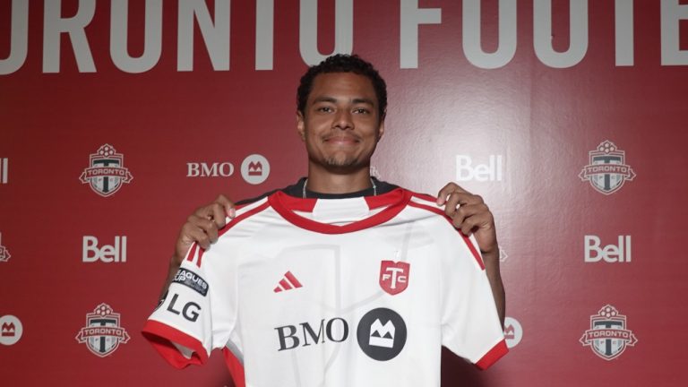 Newly-signed American defender Henry Wingo shows off his Toronto FC jersey at the MLS club’s training centre in Toronto on Wednesday, July 31, 2024. (THE CANADIAN PRESS/Neil Davidson)