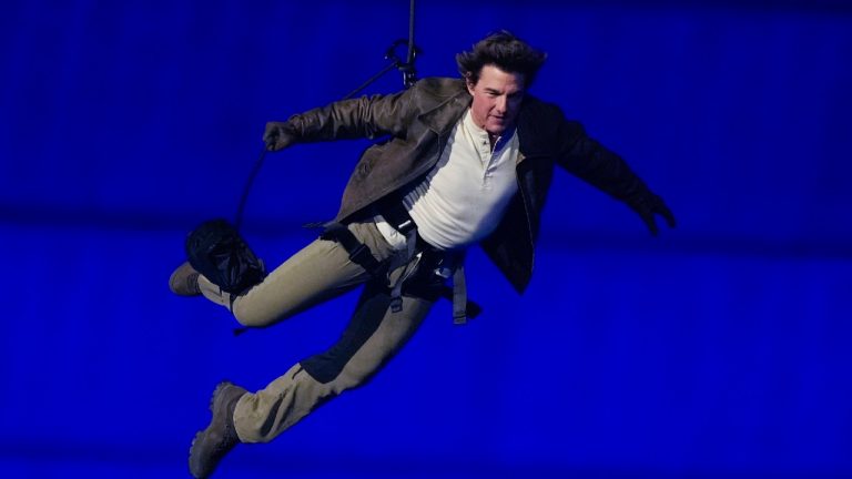 Tom Cruise is lowered on the State de France during the 2024 Summer Olympics closing ceremony, Sunday, Aug. 11, 2024, in Saint-Denis, France. (Natacha Pisarenko/AP)