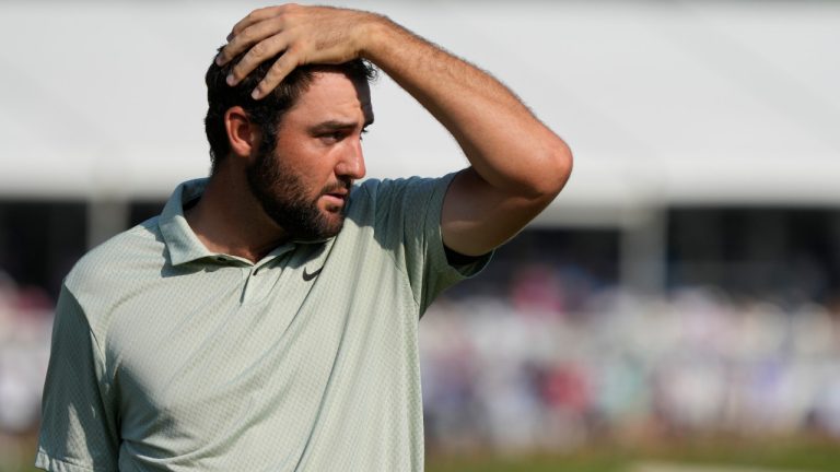 Scottie Scheffler walks off the 18th green after the final round of the St. Jude Championship golf tournament Sunday, Aug. 18, 2024, in Memphis, Tenn. (Mark Humphrey/AP)