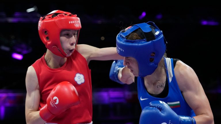 Taiwan's Lin Yu-ting, left, fights Bulgaria's Svetlana Staneva in their women's 57 kg quarterfinal boxing match at the 2024 Summer Olympics, Sunday, Aug. 4, 2024, in Paris, France. (Ariana Cubillos/AP Photo)