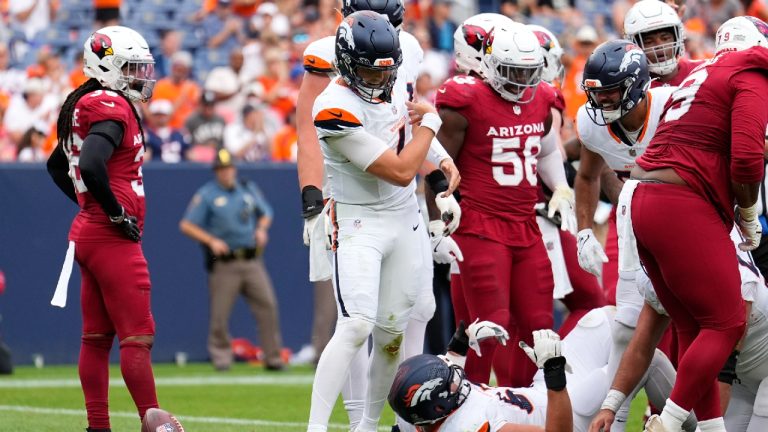 Denver Broncos quarterback Zach Wilson, centre, celebrates his touchdown run against the Arizona Cardinals during the second half of a preseason NFL football game Sunday, Aug. 25, 2024, in Denver. (Jack Dempsey/AP)