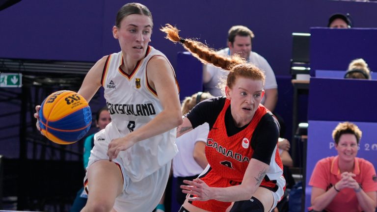 Germany's Elisa Mevius (8) drives past Canada's Kacie Bosch (4) in the women's 3x3 basketball pool round match during the 2024 Summer Olympics, Thursday, Aug. 1, 2024, in Paris, France. Germany won 19-15. (Frank Franklin II/AP)