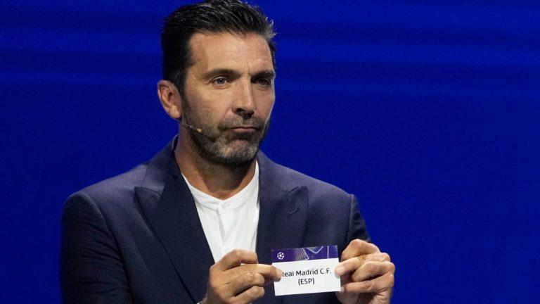 Former Italian goalkeeper Gianluigi Buffon holds a ticket for Real Madrid during the Champions League draw, in Monaco, Thursday, Aug. 29, 2024. (Gregorio Borgia/AP Photo)