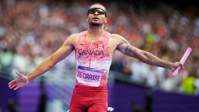 Andre de Grasse, of Canada, celebrates after winning the men's 4 x 100-meter relay final at the 2024 Summer Olympics, Friday, Aug. 9, 2024, in Saint-Denis, France. (Petr David Josek/AP)