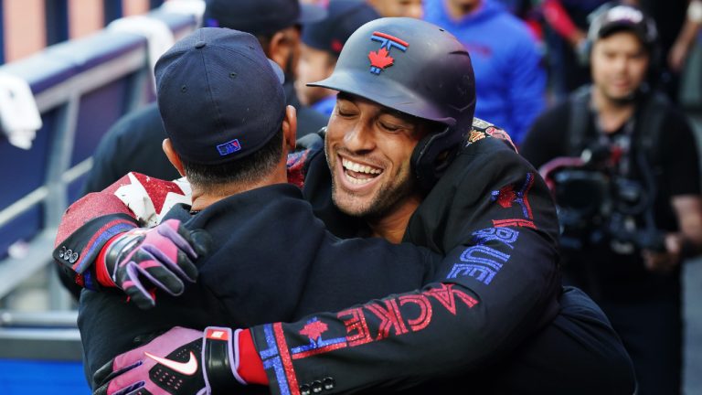 Toronto Blue Jays' George Springer (4) celebrates after hitting a solo home run against the Cincinnati Reds during first inning interleague MLB baseball action in Toronto on Wednesday, August 21, 2024. (Chris Young/CP)