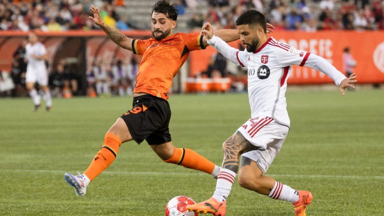 Toronto FC forward Lorenzo Insigne (24) moves the ball past Forge FC midfielder Tristan Borges (9) during first half Canadian Championship semifinal action in Hamilton, Ont., on Wednesday, July 10, 2024. (Nick Iwanyshyn/CP)