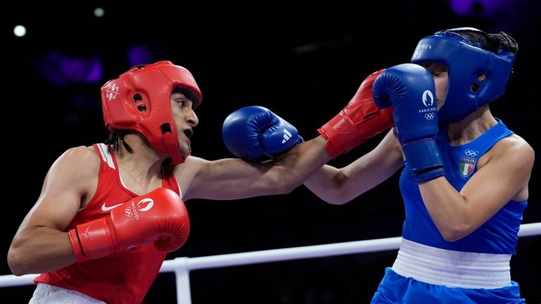 Algeria's Imane Khelif, left, fights Italy's Angela Carini in their women's 66kg preliminary boxing match at the 2024 Summer Olympics, Thursday, Aug. 1, 2024, in Paris, France. (John Locher/AP Photo)