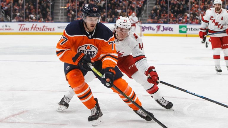 Carolina Hurricanes' Julien Gauthier chases Edmonton Oilers' Oscar Klefbom (77) during first period NHL action in Edmonton, Alta., on Tuesday December 10, 2019. (Jason Franson/CP)