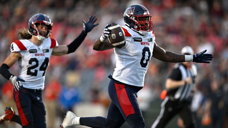 Montreal Alouettes defensive end Shawn Lemon (0) scores a touchdown after a fumble by Ottawa Redblacks quarterback Dustin Crum, not shown, during second half CFL football action in Ottawa on September 30, 2023. (Justin Tang/THE CANADIAN PRESS)