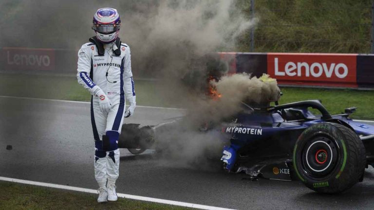 Williams driver Logan Sargeant of the US walks away from his car after he crashed during the third free practice ahead of the Formula One Dutch Grand Prix race at the Zandvoort racetrack. (Peter Dejong/AP)