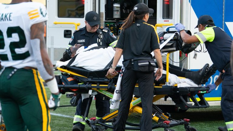 Hamilton Tiger Cats' Luther Hakunavanhu is taken to an ambulance after being injured on the field following the first play of CFL football game action against the Edmonton Elks in Hamilton, Ont. on Saturday, August 17, 2024. (Peter Power/THE CANADIAN PRESS)