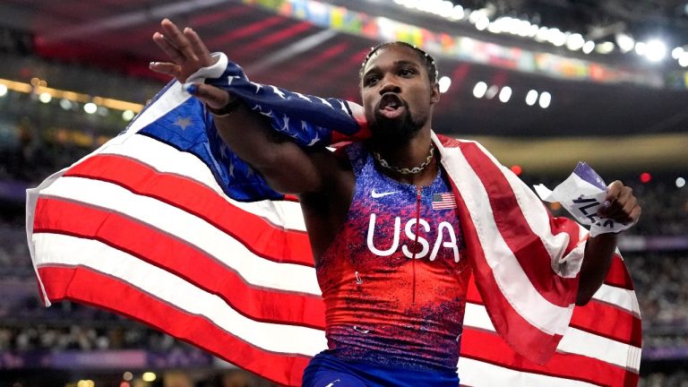 Noah Lyles, of the United States, celebrates after winning the men's 100-metre final at the 2024 Summer Olympics, Sunday, Aug. 4, 2024, in Saint-Denis, France. (Matthias Schrader/AP)