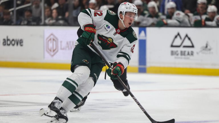 Minnesota Wild left wing Matt Boldy (12) moves the puck during the third period of an NHL hockey game against the Los Angeles Kings, Wednesday, March 20, 2024, in Los Angeles. (Yannick Peterhans/AP)