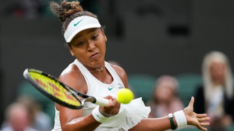 Naomi Osaka of Japan plays a forehand return to Emma Navarro of the United States during their match on day three at the Wimbledon tennis championships in London, Wednesday, July 3, 2024. (Alberto Pezzali/AP Photo)