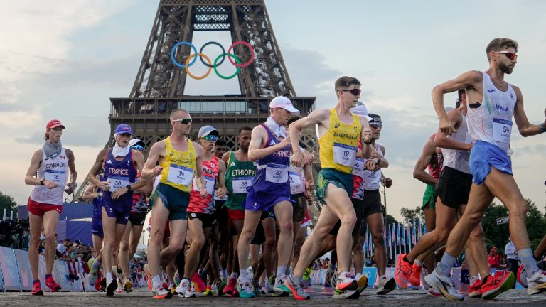 Canada's Evan Dunfee (18), France's Aurelien Quinion (38), Australia's Declan Tingay (14), France's Gabriel Bordier (37), Australia's Kyle Swan (12) and Italy's Riccardo Orsoni (54) compete during the men's 20km race walk at the 2024 Summer Olympics, Thursday, Aug. 1, 2024, in Paris, France. (Vadim Ghirda/AP)