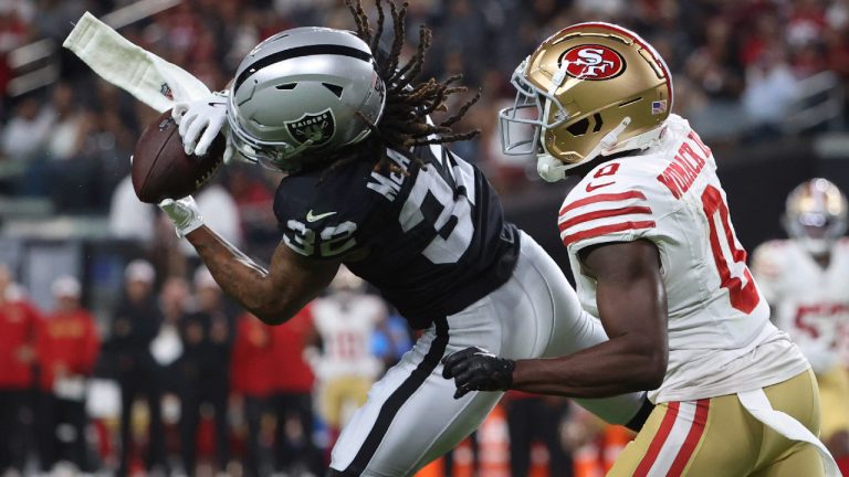 Las Vegas Raiders wide receiver Tyreik McAllister (32) makes a catch against San Francisco 49ers cornerback Samuel Womack III (0) before running it in for a touchdown during the second half of an NFL preseason football game, Friday, Aug. 23, 2024, in Las Vegas. (Ian Maule/AP)