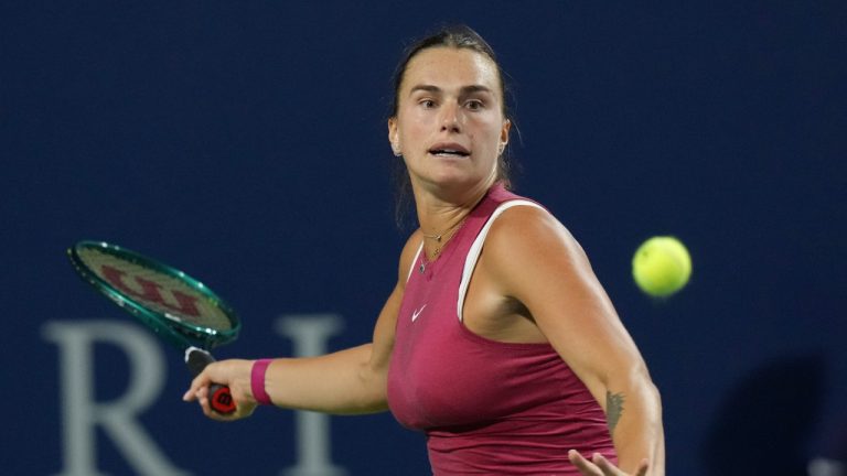 Aryna Sabalenka of Belarus hits a return to Katie Boulter of Great Britain at the National Bank Open in Toronto on Friday, August 9, 2024. (Chris Young/CP)